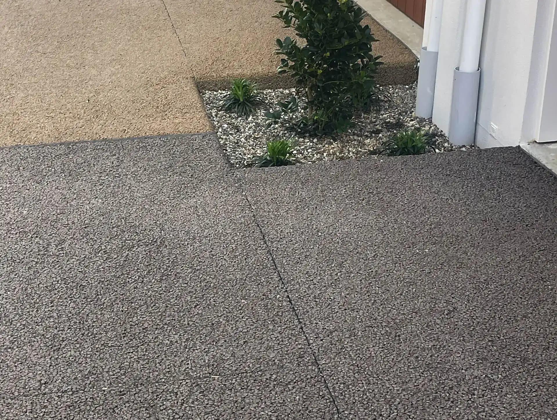 Charcoal permeable concrete driveway with a seamless finish