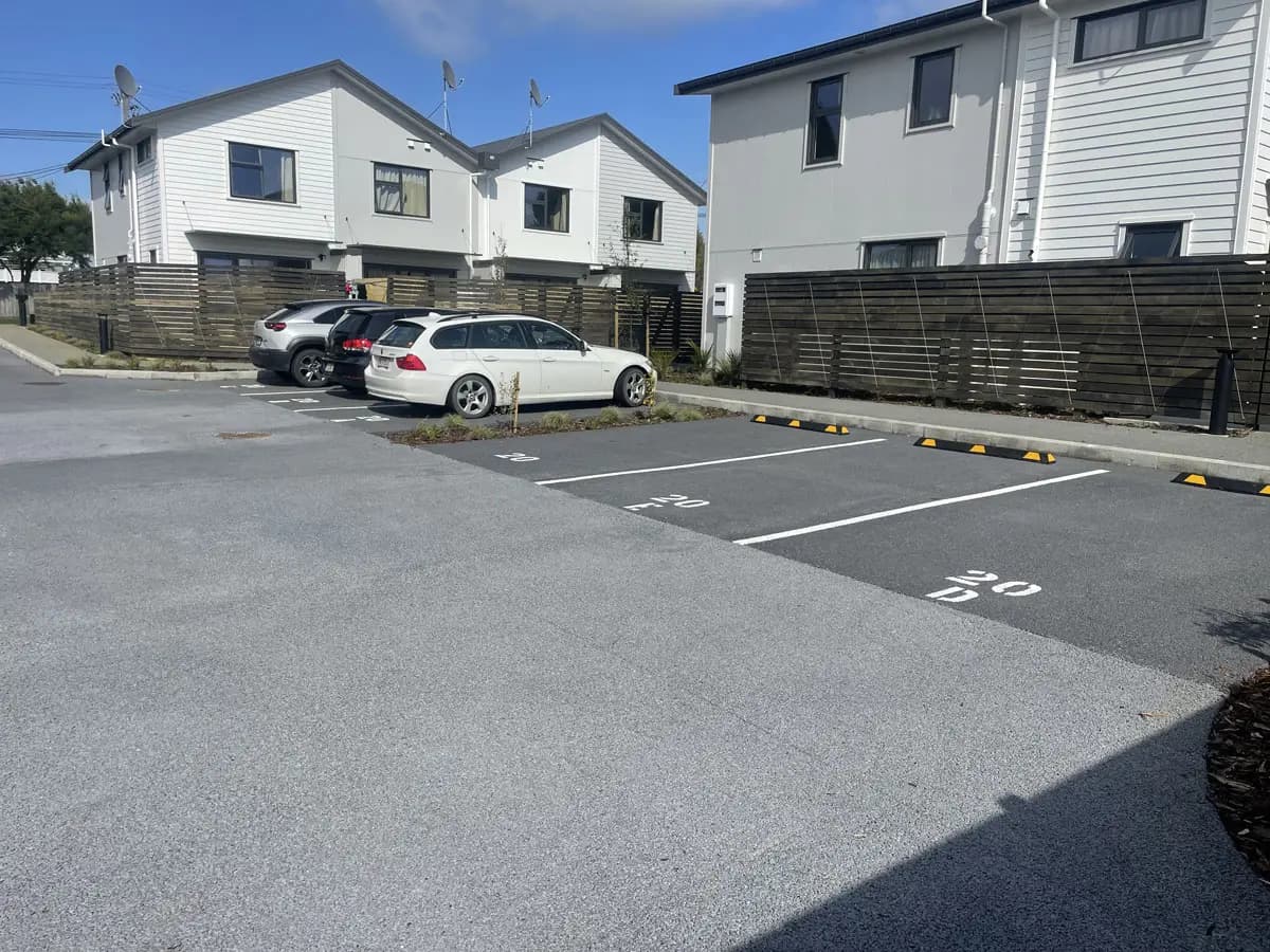 Carpark with permeable concrete surface, showing marked parking bays