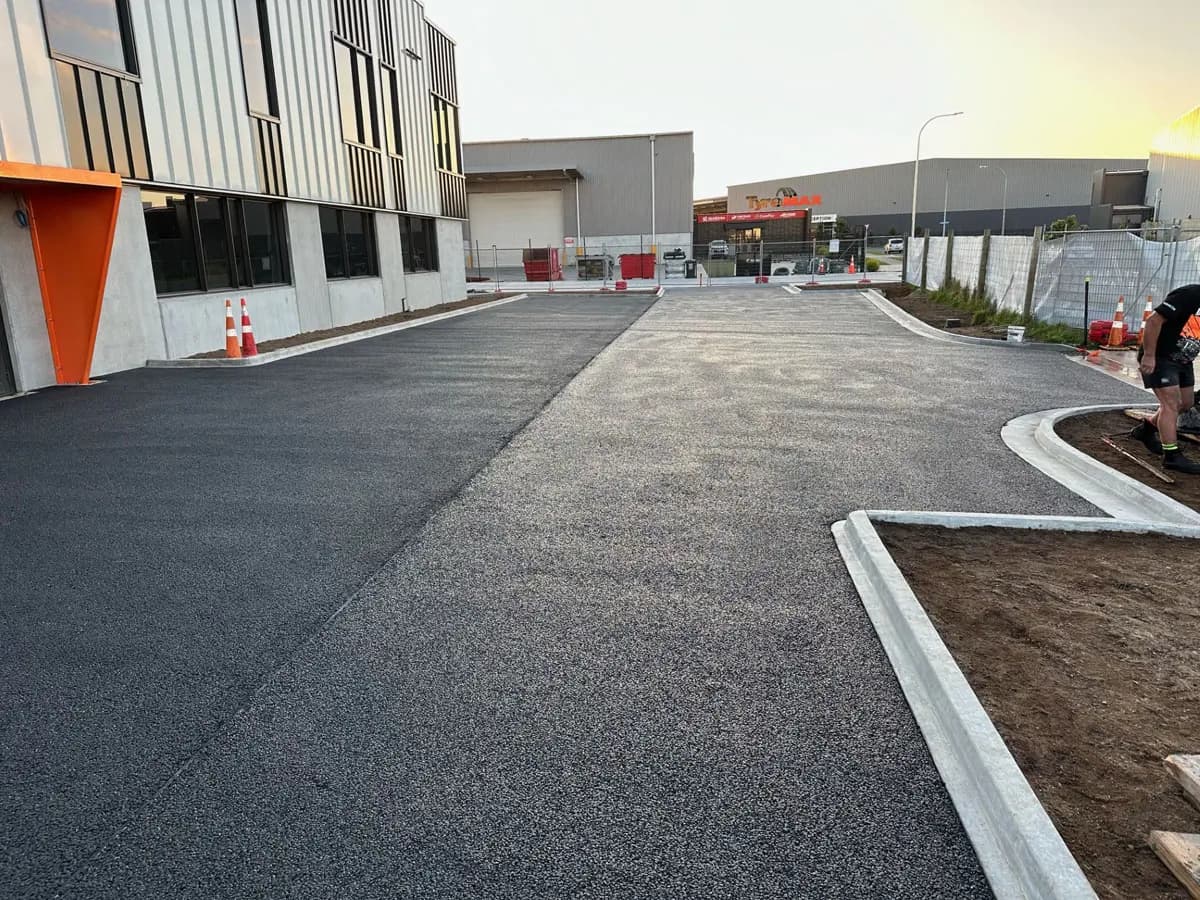Carpark surfaced in permeable concrete, showing the open-textured finish