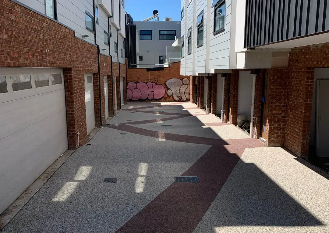 Modern permeable concrete courtyard in a residential complex.